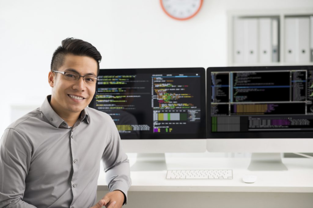 Portrait of smiling Vietnamese software engineer