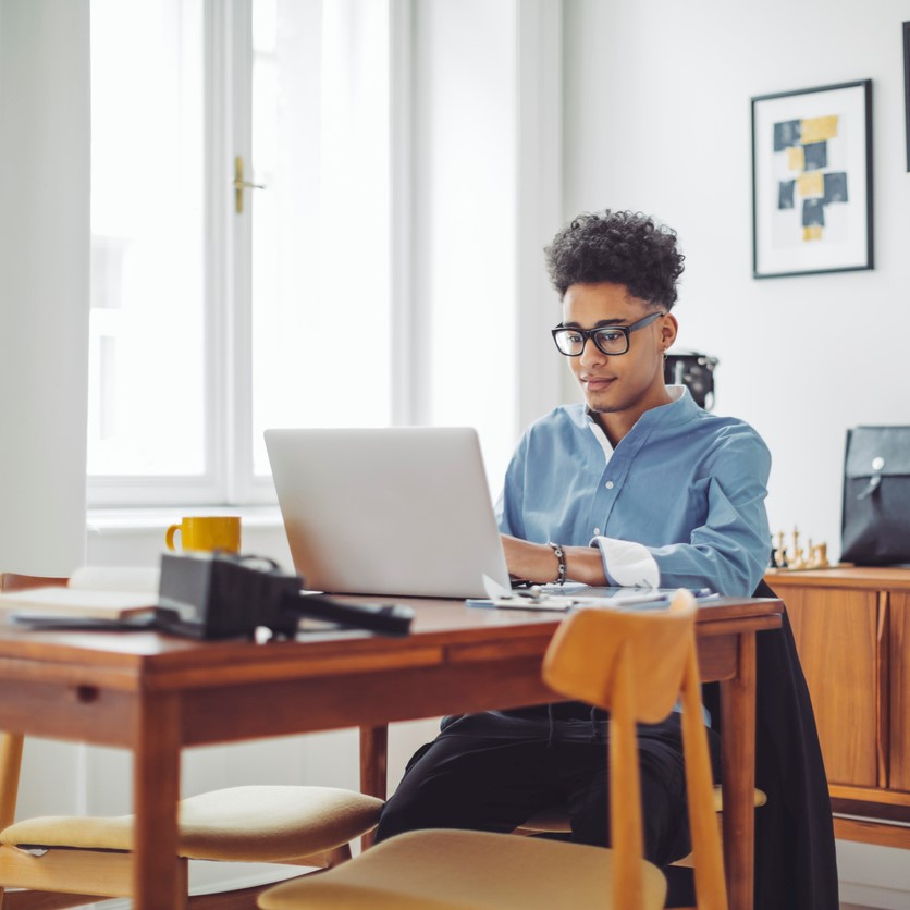Retail Website  Lifestyle Content - young man sitting at desk on laptop